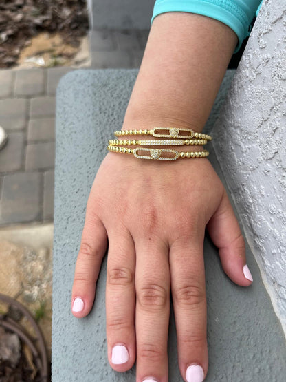 14K Gold Plated Oval Bead Clasped Bangle Accented With Cz Bar Center Wholesale