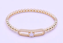 14K Gold Plated Oval Bead Clasped Bangle Accented With Cz & Mother Of Pearl Flower Bar Center