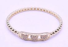 14K Gold Plated Oval Bead Clasped Bangle Accented With 3 Cz Hearts Bar Center Wholesale