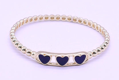 14K Gold Plated Oval Bead Clasped Bangle Accented With 3 Mother Of Pearl Hearts Bar Center Wholesale