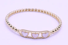 14K Gold Plated Oval Bead Clasped Bangle Accented With 3 Mother Of Pearl Hearts Bar Center Wholesale
